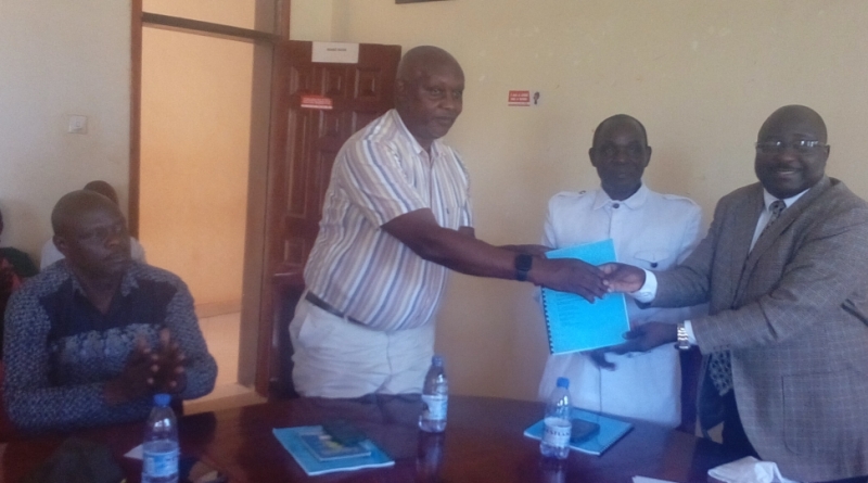 Outgoing District Chairperson (right) handing over office to CAO
