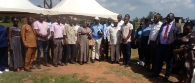 A group photograph capturing attendees after the official commissioning of the solar water supply system in Mitimito village.