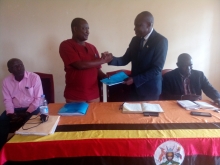 Mayuge District outgoing CAO, Mr. Magumba Eria (standing left) handed over office to new CAO, Mr. Eswilu Donath on Friday 12th Jan 2024