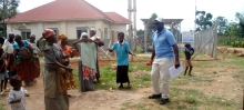Country Director of Life Water International, Mr. Curuma Emmanuel dancing with community members