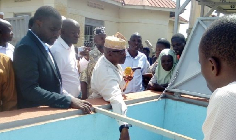 Mayuge RDC, Lt. Hajji Walugembe Aramandhani, officially commissions the solar-powered water supply system in Mitimito village (November 2025).